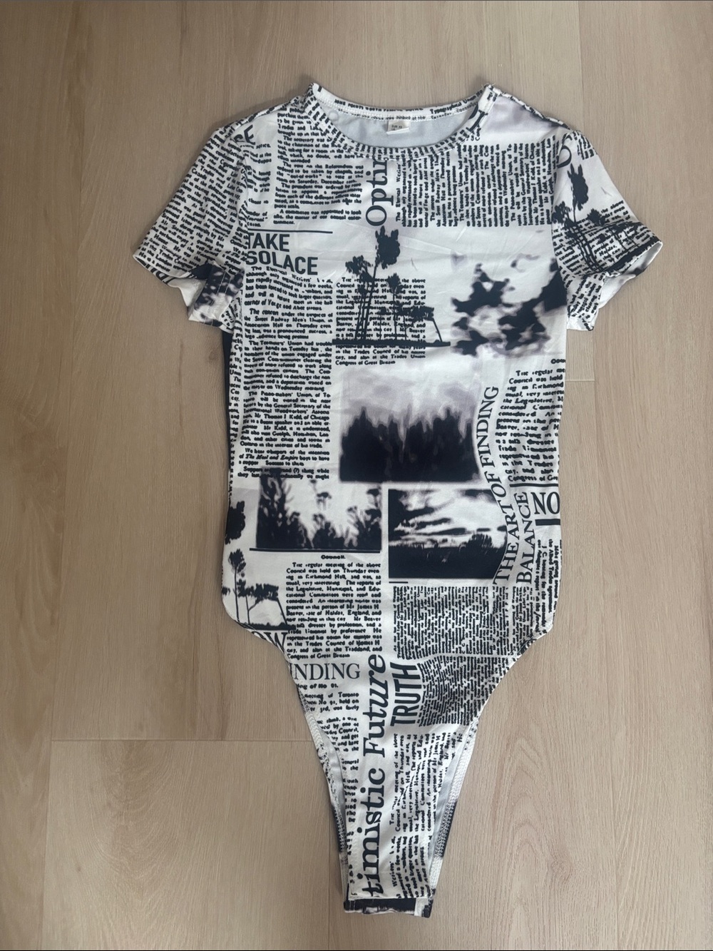 Worn Once Newspaper Print One-Piece Bodysuit - Black & White